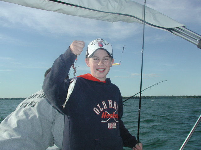 My nephew John with the first catch on the Macattack.  4" silver bass