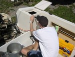 Here's Dave installing a new hasp.  I was a bit dismayed that wellcraft factory installed chrome plated zinc for all it's deck hardware... it might as well be chrome plated sh*t...complete garbage.