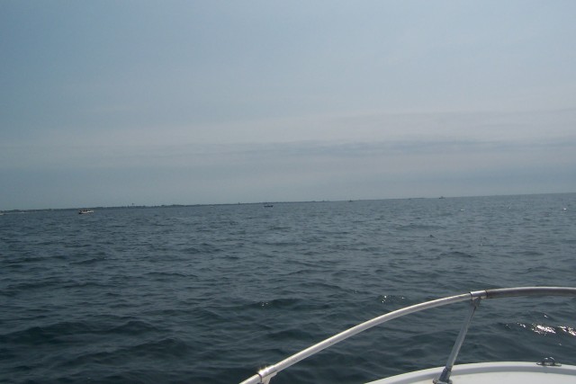 Boats were starting to gather around the West Wall of Point Judith.