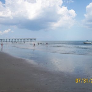 Anchored in the surf, Holden Beach, NC, on a dead calm Bermuda High summer day. 