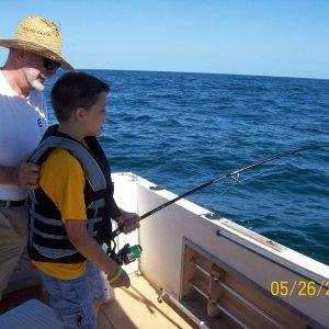 A shark about to pull Joey in, Pawpaw holds on.