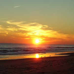 Sunset on the NC coast. Yes I know we are on the east coast and the sun sets in the west.  The beach runs east and west here so in the winter the sunr