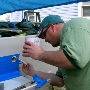 My son painting newly exposed wood