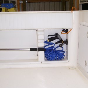 Stbd side aft, washdown hose & battery charger waterproof outlet.