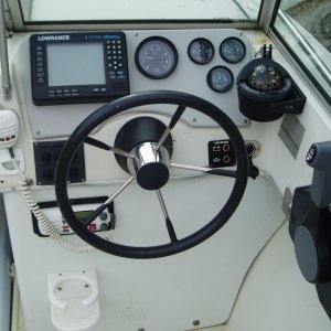 Old LMS 350(sonar and GPS) built into dash...essential gauges only; 2 fuel, volt and tach...VHF mike handy, but hard to see display on radio...gotta t