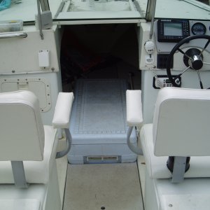 2 Fat-Boy swivel seats...120 quart cooler in front hatch is fish-box...custom-cut 3/4" Starboard lid covers remaining hatch for more storage...