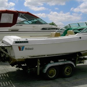 Before - Rear Starboard. I hate the old brown bottom paint. Still have the platform. It's refinished, and waiting for next year.