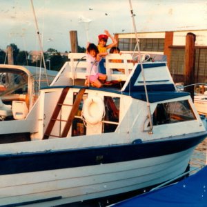 First boat and kids there all grown up know the little guy on the stern is 20 know