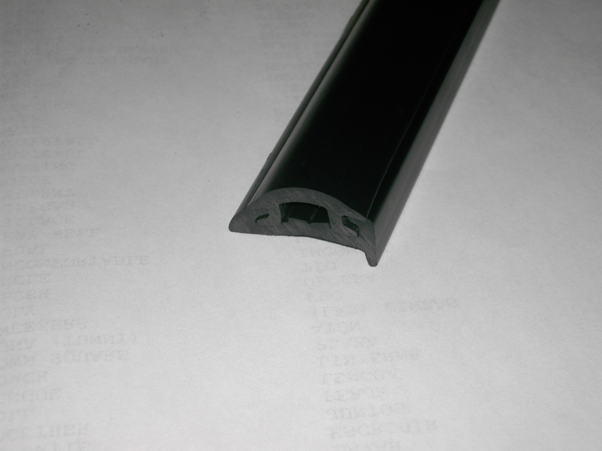 A section of the new rail. Semi rigid vinyl and rubber insert.