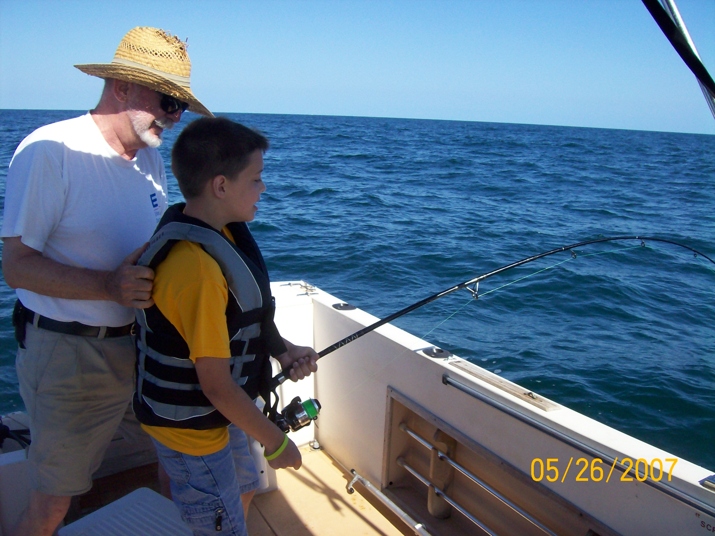 A shark about to pull Joey in, Pawpaw holds on.