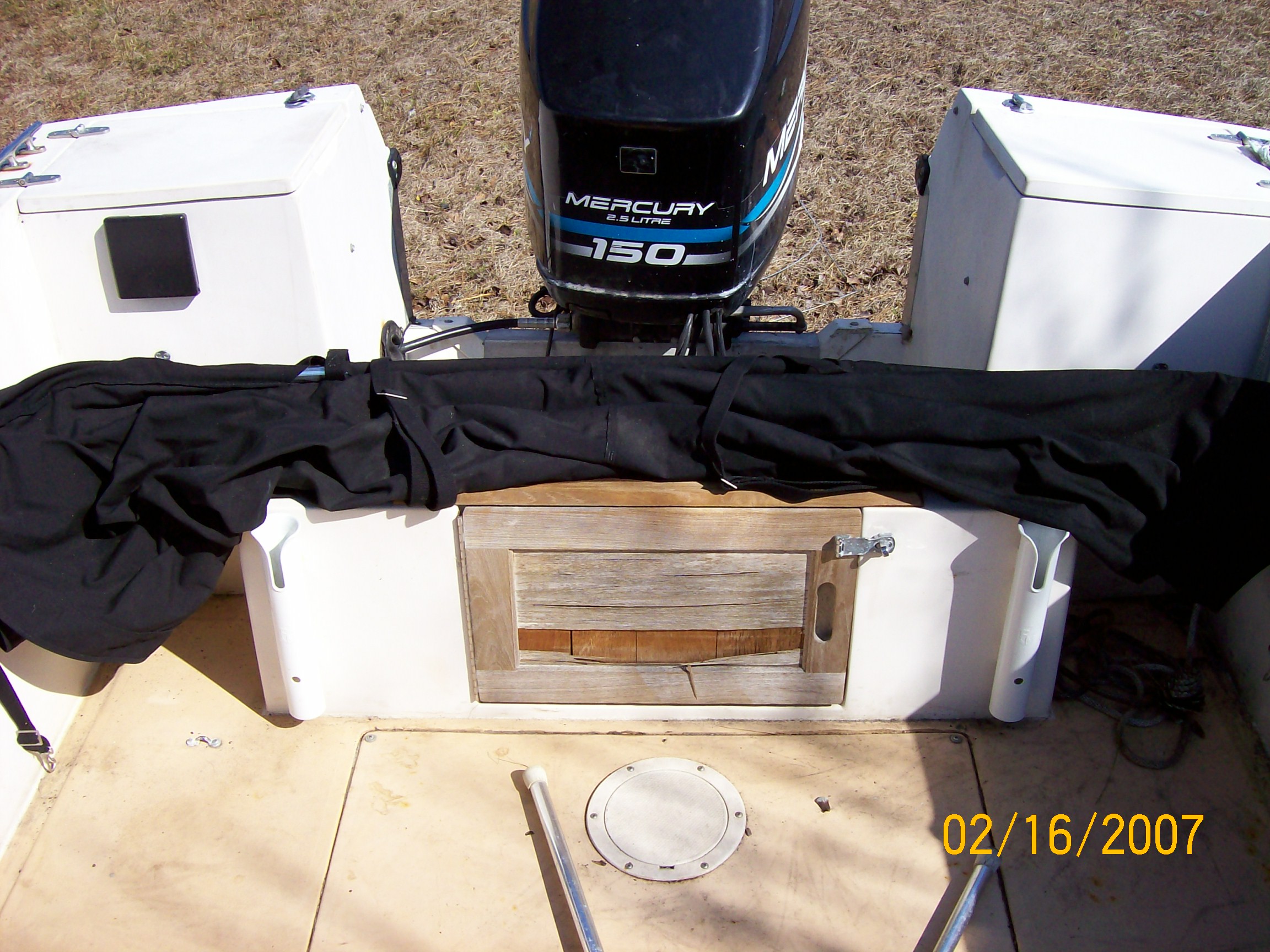 A view of the transom area.  Black canvass is the Bimini Top.