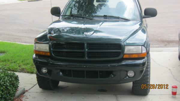 an 1999 Dodge Durango from Maine (rust) to pull it, front end damage, no heat and ac, two windows not working, rear hatch wont stay up and in need of 