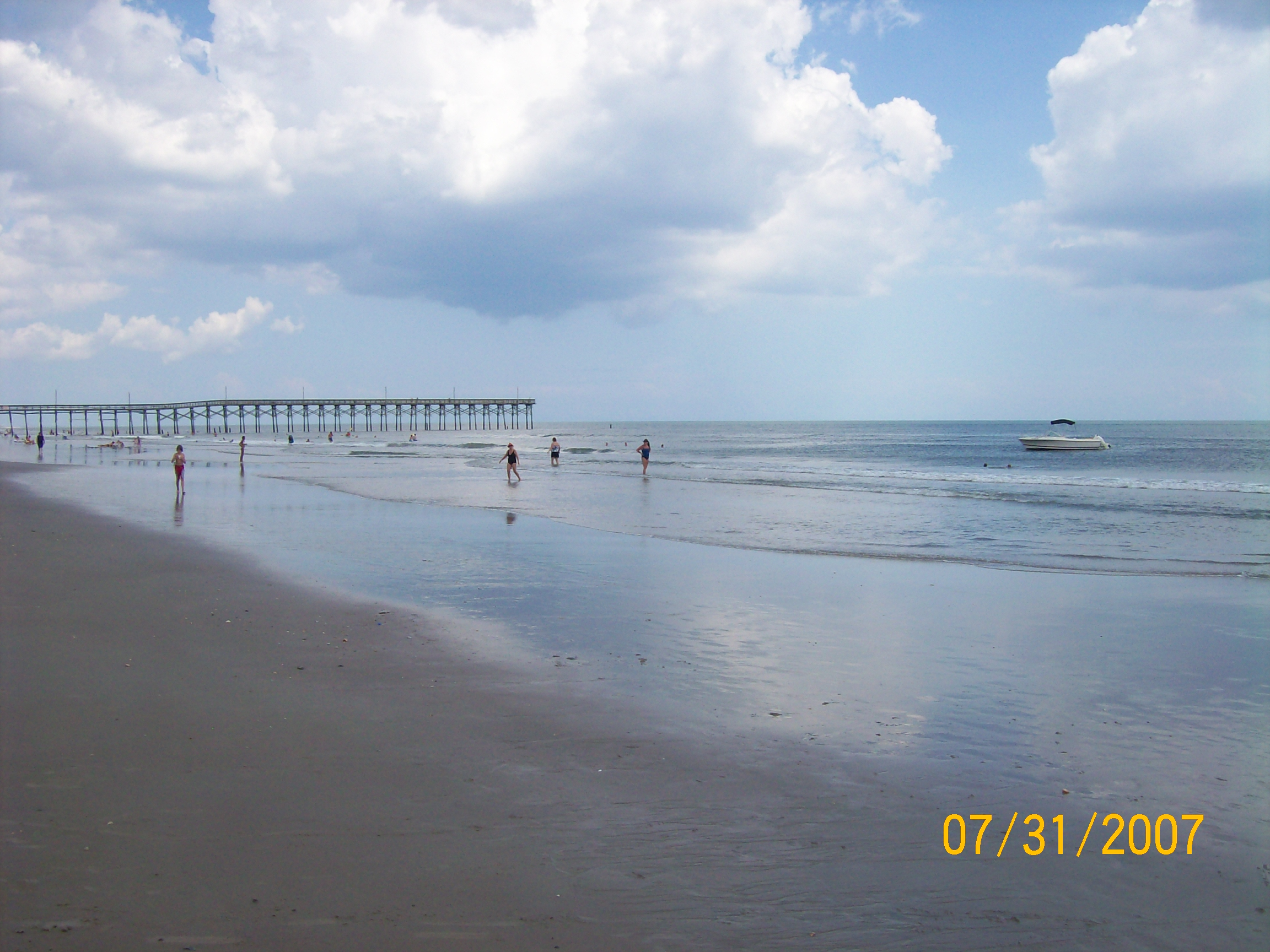 Anchored in the surf, Holden Beach, NC, on a dead calm Bermuda High summer day. 