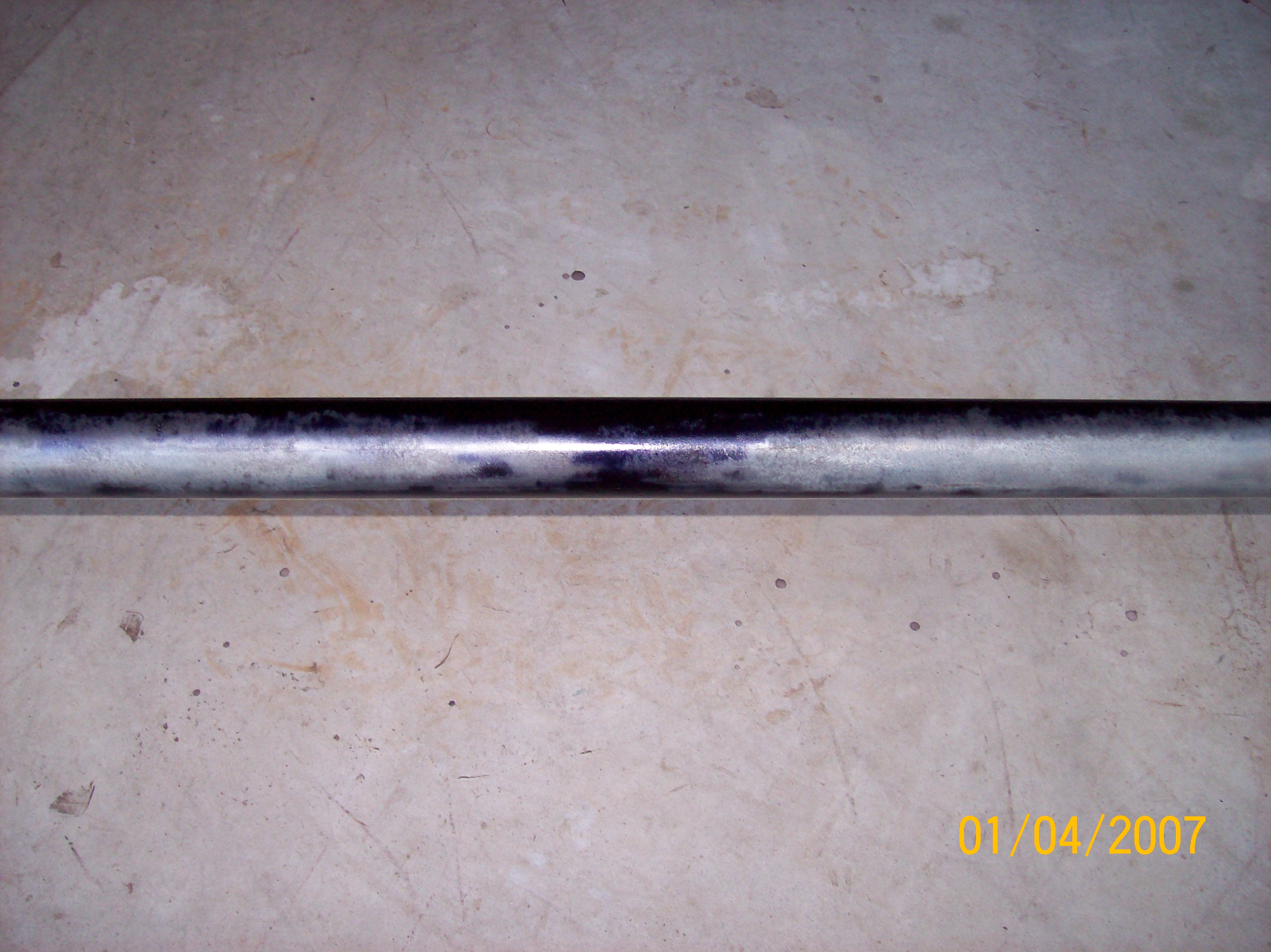 Axle sprayed with Rust Converter