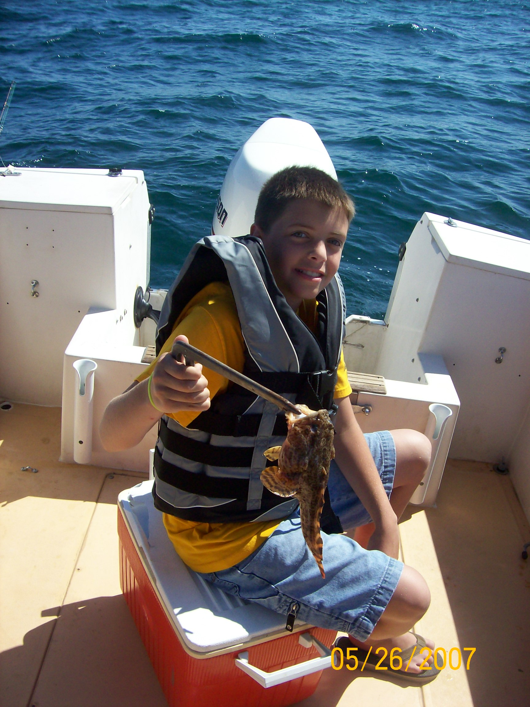 Joey with a toad fish.