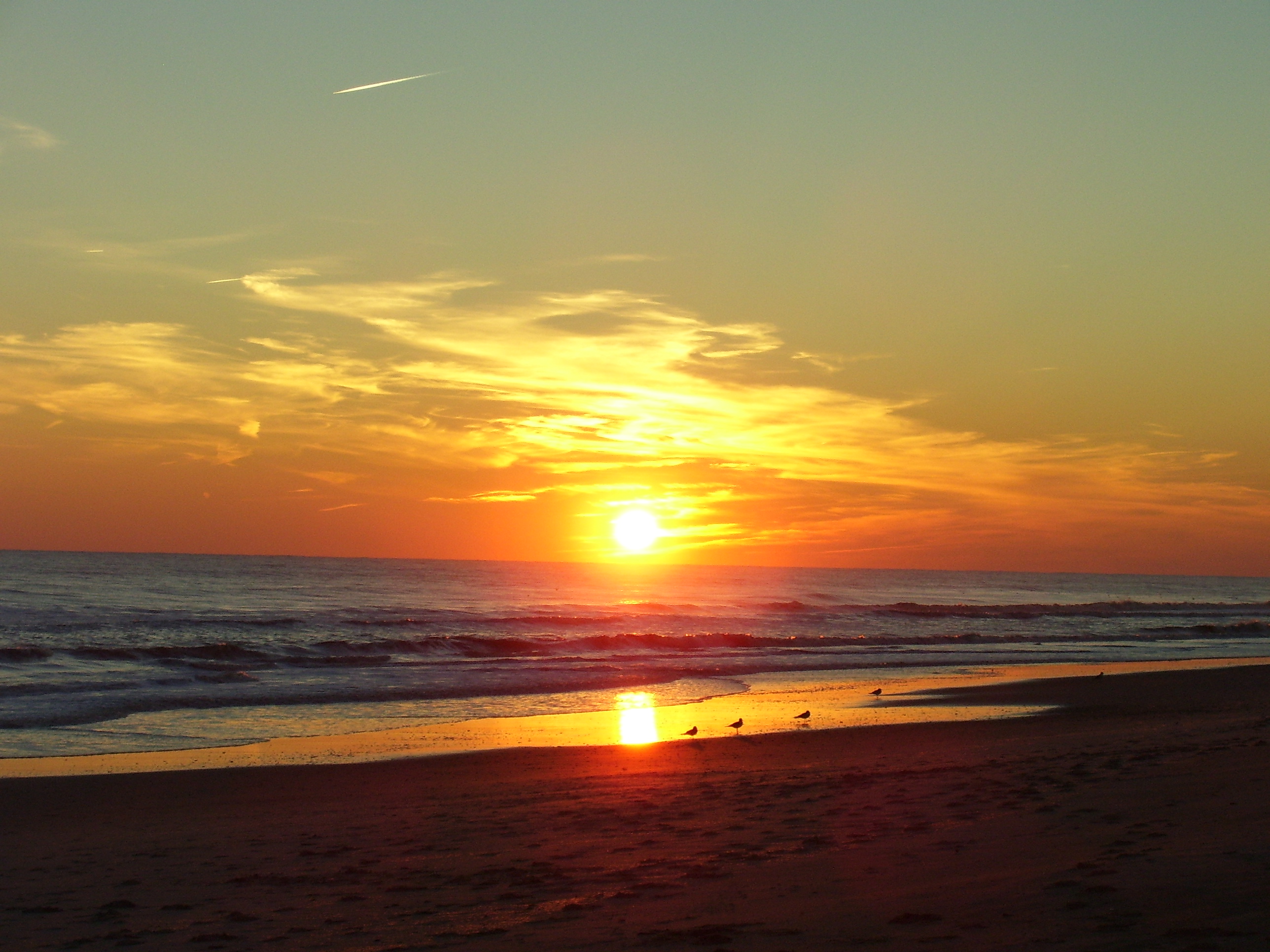 Sunset on the NC coast. Yes I know we are on the east coast and the sun sets in the west.  The beach runs east and west here so in the winter the sunr